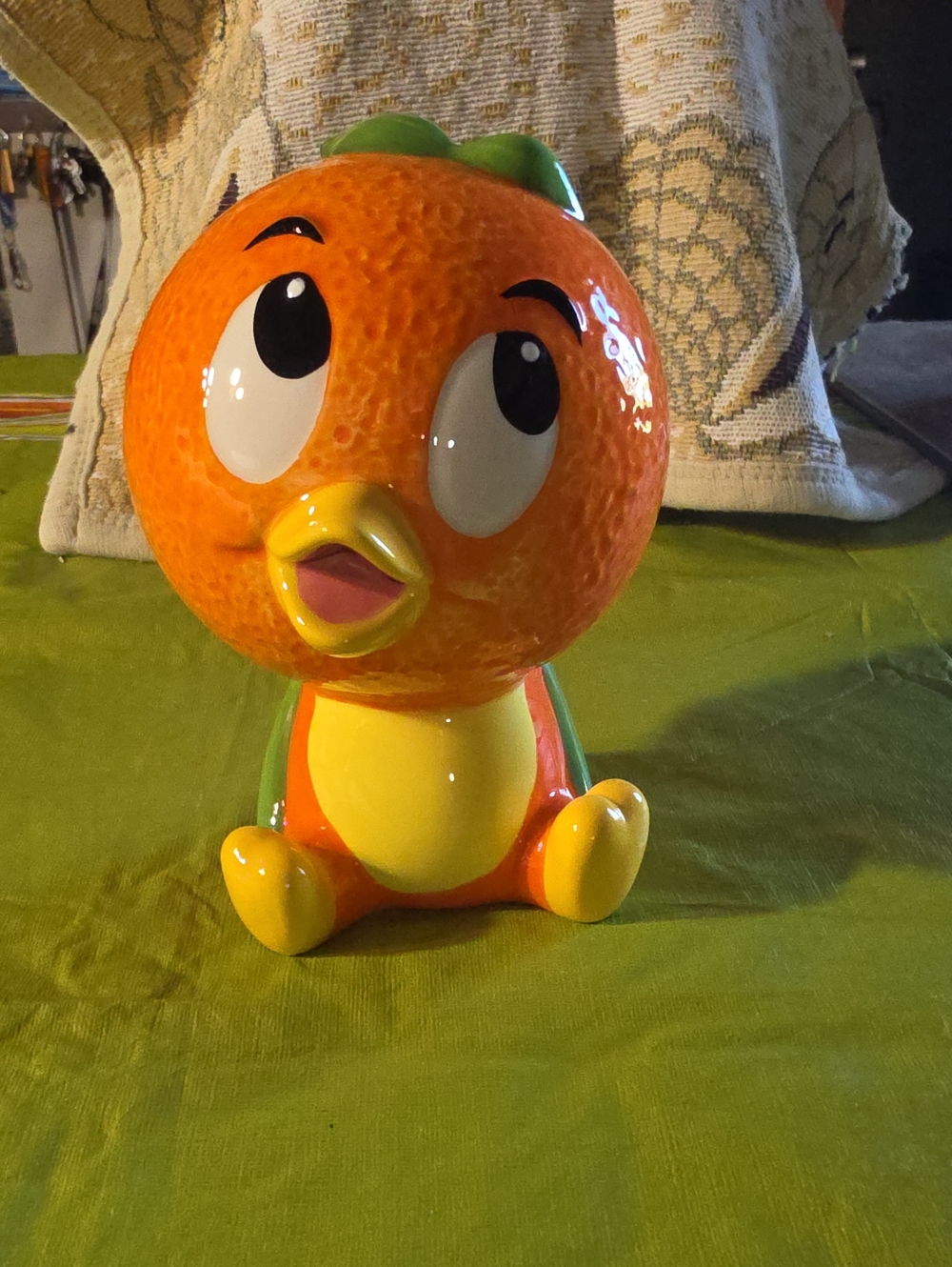 Disney Orange Bird Figurine with Yellow Beak and Green Leaf Detail